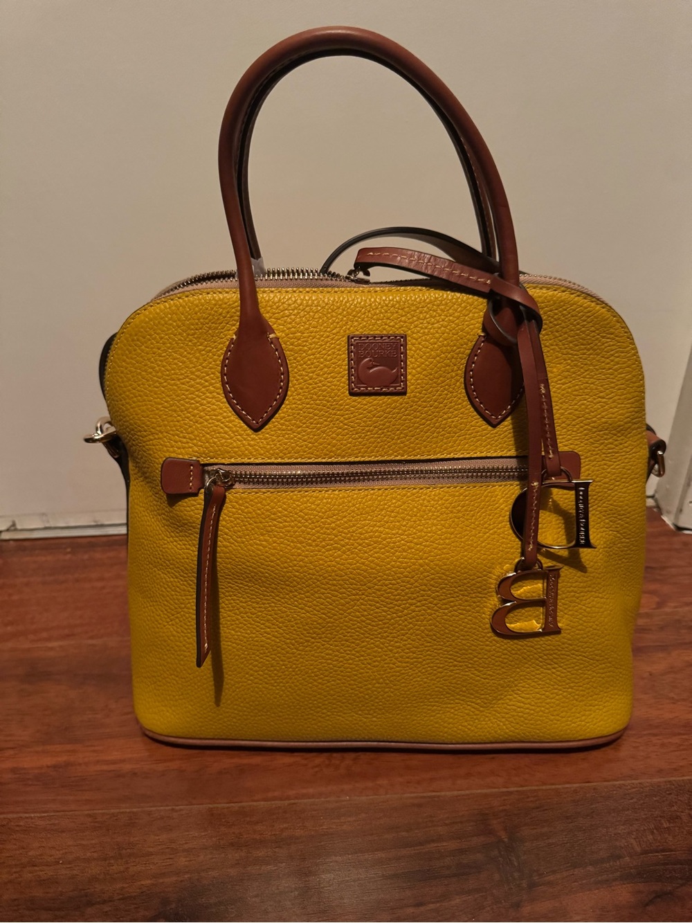 Dooney & Bourke Yellow Pebbled Leather Dome Satchel with Brown Trim and Charm